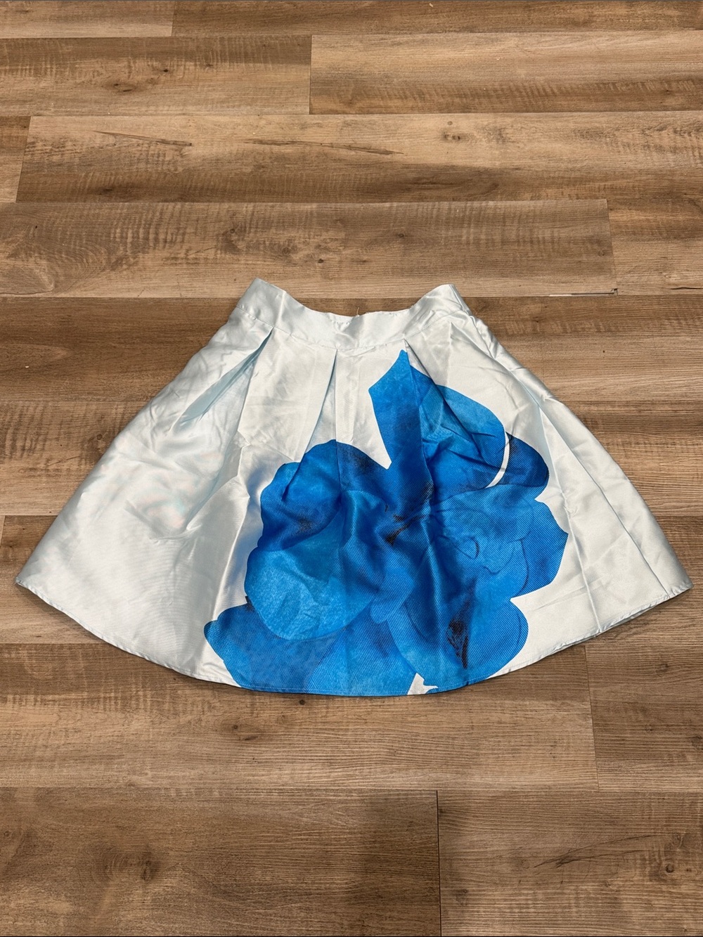Banjul white satin-finish poofy flare skirt with a bold blue watercolor floral